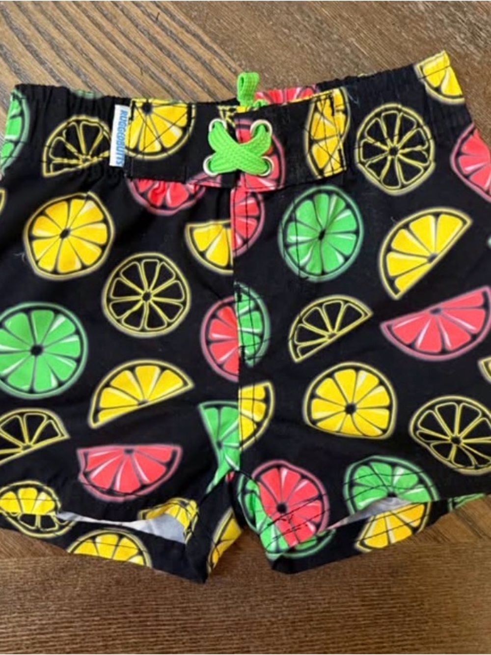 Kids Black Citrus Swim Trunks with Green Drawstring